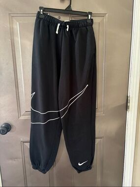 Big kids XL Nike Black Joggers with White Swoosh Outline